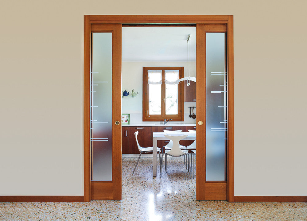 An Eclisse double pocket door system can be used to divide a kitchen area and a living area.